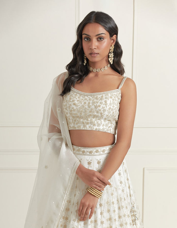 White hand embroidered organza blouse with satin lehenga and organza dupatta