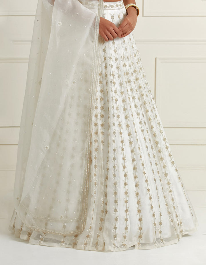 White hand embroidered organza blouse with satin lehenga and organza dupatta