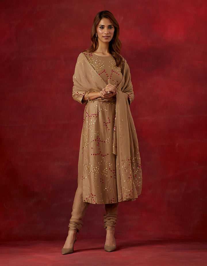 Beige embroidered chanderi silk kurta and churidar with tissue dupatta