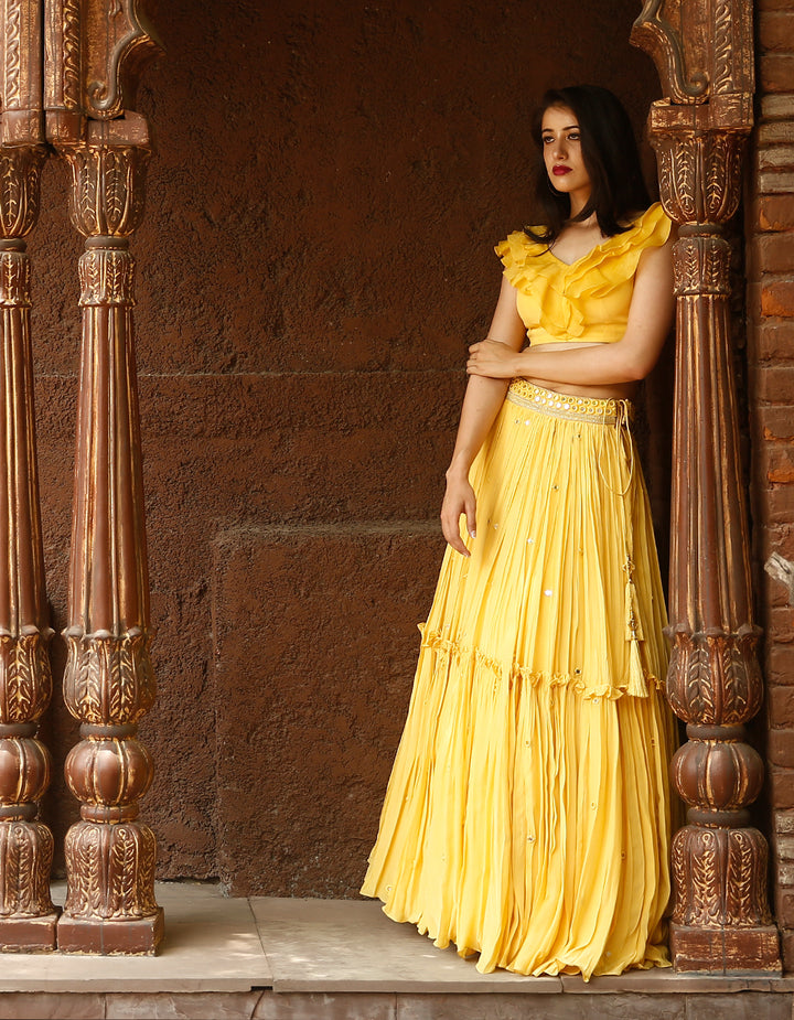 Yellow Crepe lehenga with mirror work and organza frill blouse