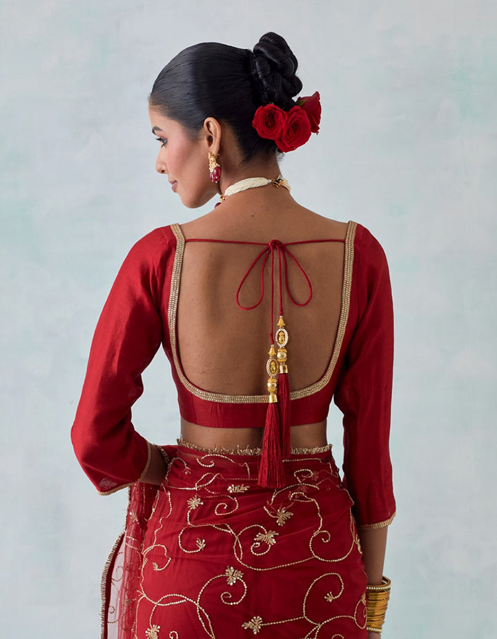 Red embroidered chanderi blouse with net saree and satin petticoat