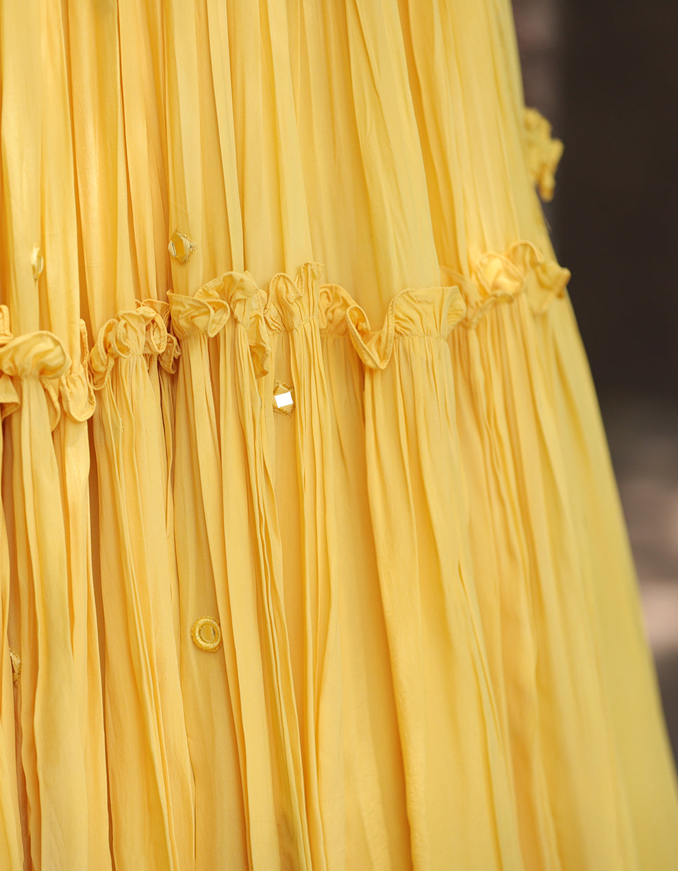 Yellow Crepe lehenga with mirror work and organza frill blouse