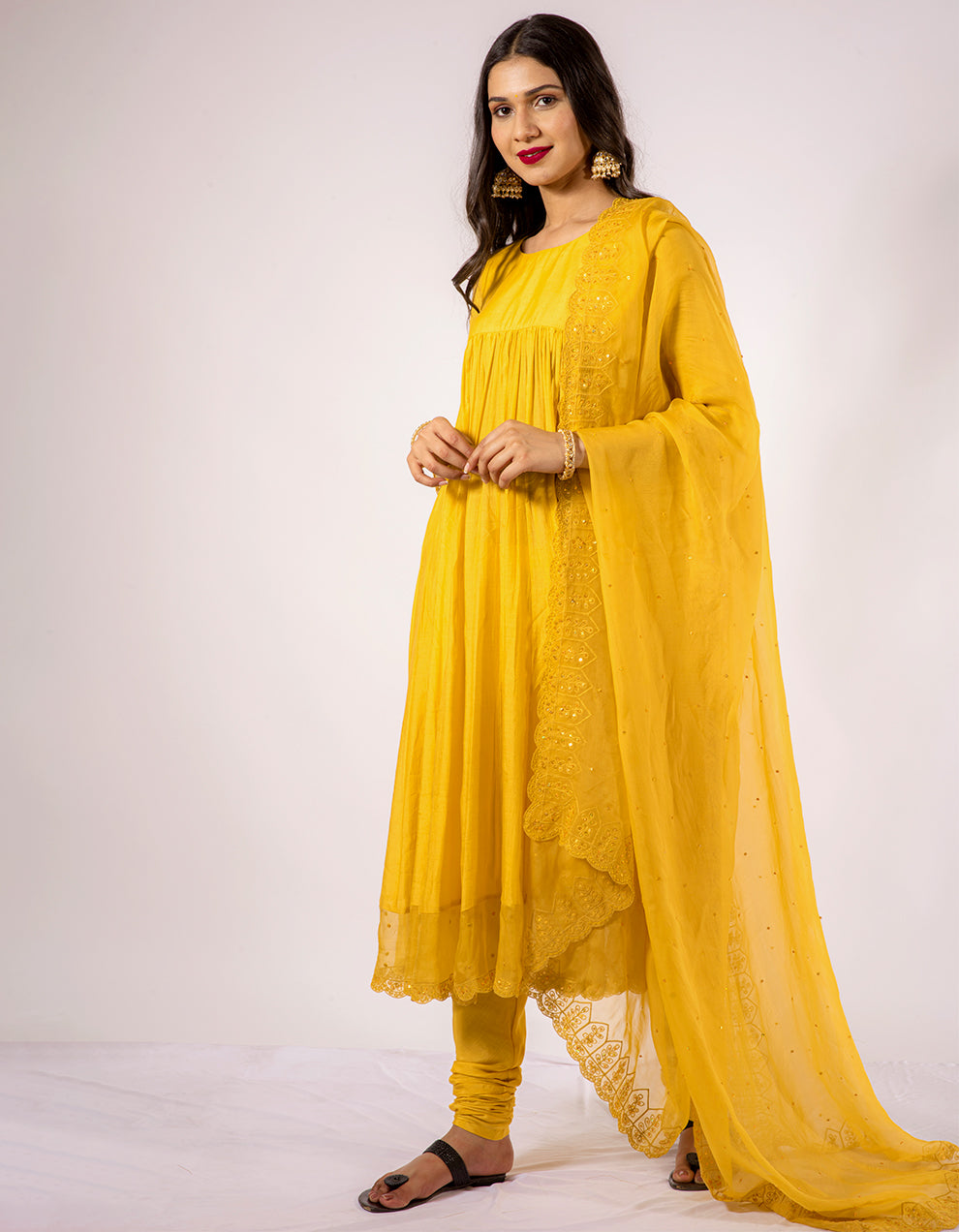 Yellow anarkali kurta with churidar pants